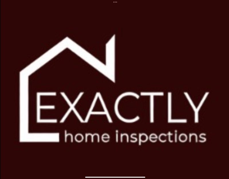Inspector standing in front of an inspected home